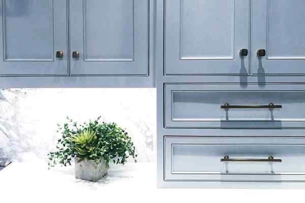 Adding greenery to the glass kitchen cabinets